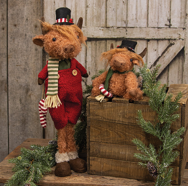 SITTING HIGHLAND COW W/ CANDY CANE